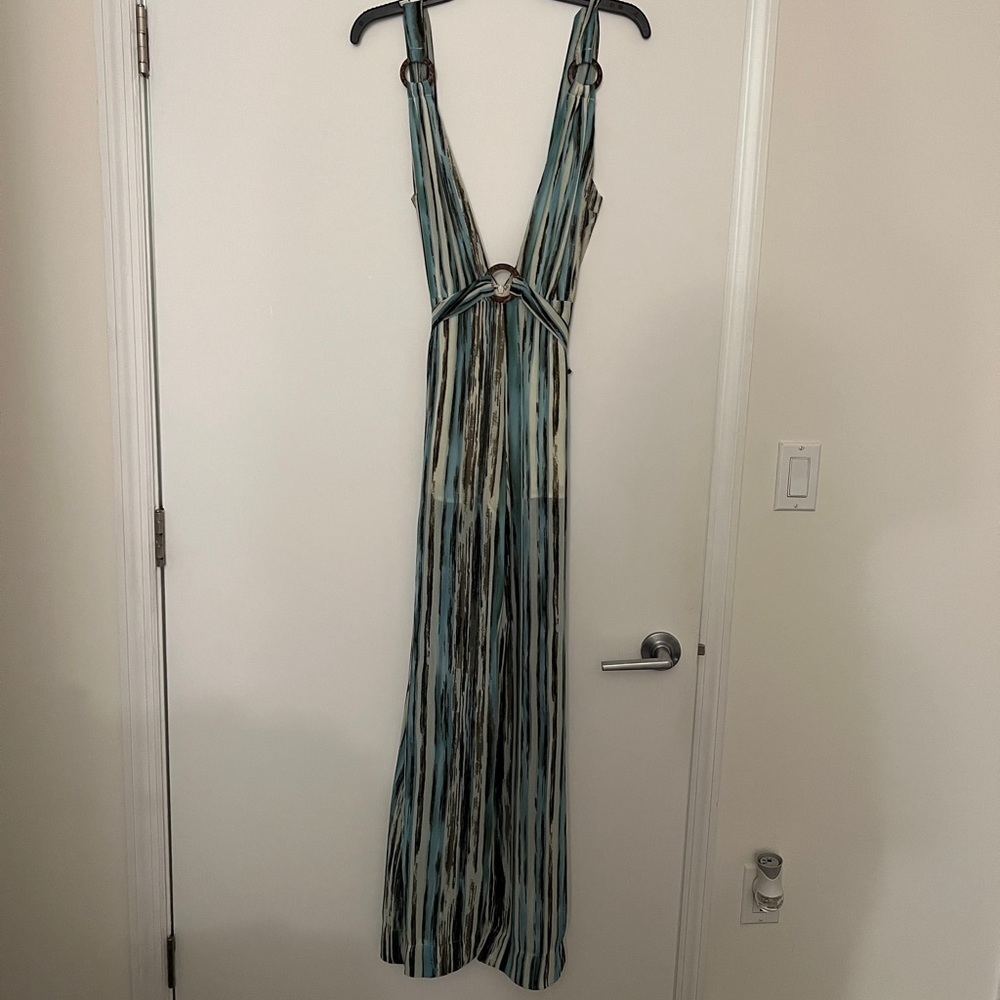 Luxxel blue striped jumpsuit with round wood embellishments. Worn once. Size S.